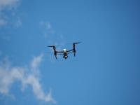 Drone flying in the blue sky