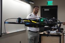drone flying in front of teacher