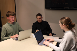 group of students working together on computers