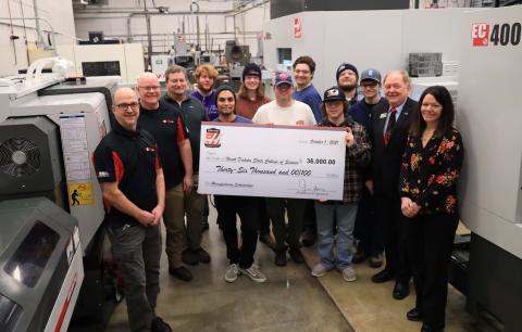 NDSCS Precision Machining Technology students, faculty and administrators were on hand when Dave Chase, Productivity, Inc. Machine Tool Sales Representative, visited the department to present a check for $36,000.