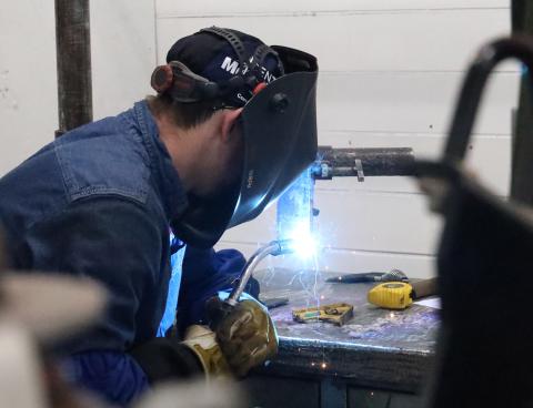 Student welding during contest