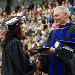 Graduate receiving diploma