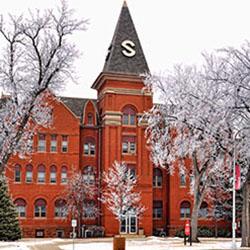 Old Main in the winter with frosty trees