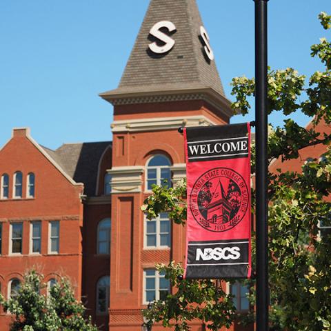 Old Main with sign